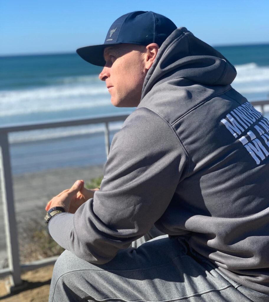 TD Sitting on Bench Looking at Ocean